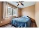 Cozy bedroom with a large window overlooking a mountain view and a ceiling fan at 4 Virginia St, Idaho Springs, CO 80452