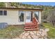 Front entryway with a painted porch with flagstone walkway at 4 Virginia St, Idaho Springs, CO 80452