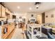 Bright and spacious living room with a kitchen view, eat-in dining area, and hardwood floors at 4 Virginia St, Idaho Springs, CO 80452