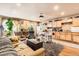 Open concept living room and kitchen, featuring lots of natural light and hardwood floors at 4 Virginia St, Idaho Springs, CO 80452