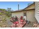 Outdoor patio with chairs, a fire pit, with hillside views and propane tank at 4 Virginia St, Idaho Springs, CO 80452