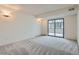 Bright and spacious bedroom with neutral carpet and ample natural light at 7000 E Quincy Ave # 317, Denver, CO 80237