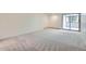 Spacious bedroom with sliding glass doors leading to balcony at 7000 E Quincy Ave # 317, Denver, CO 80237
