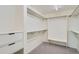 Walk-in closet with custom shelving, drawers, and ample storage at 7000 E Quincy Ave # 317, Denver, CO 80237
