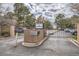 Community entrance featuring stone monument with name and gated entry at 7000 E Quincy Ave # 317, Denver, CO 80237