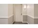 Apartment front door is decorated with unit number and modern sconce at 7000 E Quincy Ave # 317, Denver, CO 80237