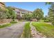 Exterior shot of complex featuring landscaped grounds and convenient walkways at 7000 E Quincy Ave # 317, Denver, CO 80237