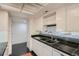 Well-lit kitchen with sleek cabinetry and modern appliances at 7000 E Quincy Ave # 317, Denver, CO 80237