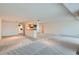 Open concept living area with convenient access to the kitchen, perfect for entertaining at 7000 E Quincy Ave # 317, Denver, CO 80237