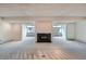 Open floor plan features a fireplace and windows offering a view of the outdoors at 7000 E Quincy Ave # 317, Denver, CO 80237