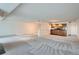 Spacious, open-concept living area featuring a bar, recessed lighting, and ample space at 7000 E Quincy Ave # 317, Denver, CO 80237