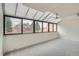 Bright sunroom featuring multiple windows and ceiling fan for added comfort at 7000 E Quincy Ave # 317, Denver, CO 80237