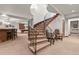 Finished basement showcasing a curved staircase, bar area, and recreation space at 4839 Bandera Pl, Parker, CO 80134