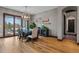 Charming dining room with wood floors, stylish decor, and plenty of natural light at 4839 Bandera Pl, Parker, CO 80134