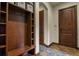 Mudroom with custom-built storage for organization and easy access to other rooms at 4839 Bandera Pl, Parker, CO 80134
