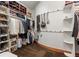 Walk-in closet with custom shelving and organization systems for clothes, shoes, and accessories at 4839 Bandera Pl, Parker, CO 80134