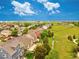 A picturesque aerial view of a suburban neighborhood with a park nearby at 11649 E 111Th Ave, Commerce City, CO 80640