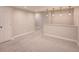 This finished basement features carpeted floors, recessed lights and a nearby bar and lounge area at 11649 E 111Th Ave, Commerce City, CO 80640