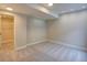 This finished basement has recessed lights, carpeted floors, and a door leading to a closet at 11649 E 111Th Ave, Commerce City, CO 80640