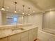 This basement features a bar with a granite countertop, pendant lights and a stainless steel sink at 11649 E 111Th Ave, Commerce City, CO 80640