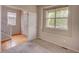 Bright bedroom with large window, plush carpeting, and ample natural light at 11649 E 111Th Ave, Commerce City, CO 80640