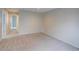 Spacious bedroom features neutral carpet and paint ready for personalization at 11649 E 111Th Ave, Commerce City, CO 80640