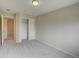 Bedroom featuring closet, carpet flooring, and neutral color palette at 11649 E 111Th Ave, Commerce City, CO 80640
