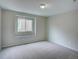 Bedroom showcasing a window and carpet flooring at 11649 E 111Th Ave, Commerce City, CO 80640
