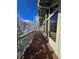 Long back deck offering expansive views of the snow-covered forest and blue sky at 2218 Witter Gulch Rd, Evergreen, CO 80439