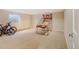 Spacious basement featuring carpet floors and a basketball arcade game at 2218 Witter Gulch Rd, Evergreen, CO 80439
