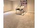 Spacious basement with a portable basketball hoop, carpet floors, and neutral paint at 2218 Witter Gulch Rd, Evergreen, CO 80439