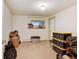 Basement with window, neutral carpet, and green trim ready for personalization and storage solutions at 2218 Witter Gulch Rd, Evergreen, CO 80439