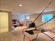 View of the expansive unfinished basement featuring a window, laundry area, and storage at 2218 Witter Gulch Rd, Evergreen, CO 80439