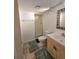 Bathroom featuring a shower, toilet, vanity and decorative mirror at 2218 Witter Gulch Rd, Evergreen, CO 80439