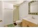 Bathroom featuring a tiled shower, a toilet, and a single sink vanity at 2218 Witter Gulch Rd, Evergreen, CO 80439