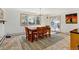 Bright dining room with wood table and chairs set, and outdoor access at 2218 Witter Gulch Rd, Evergreen, CO 80439