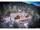 Charming mountain home with large windows, deck and stone chimney at 2218 Witter Gulch Rd, Evergreen, CO 80439