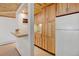 Kitchenette includes a sink, mini-fridge, and wood cabinets, creating a compact and functional space at 2218 Witter Gulch Rd, Evergreen, CO 80439