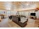 Living room with a plush leather couch, pool table, and beautiful wood ceilings at 2218 Witter Gulch Rd, Evergreen, CO 80439