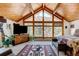 Comfortable main bedroom with a vaulted wood ceiling and a TV at 2218 Witter Gulch Rd, Evergreen, CO 80439