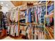 Walk-in closet features ample shelving and hanging storage for organizing wardrobes and accessories at 2218 Witter Gulch Rd, Evergreen, CO 80439