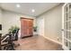 Bedroom featuring hardwood floors, closet and a French door at 12668 W 1St Pl # 81, Denver, CO 80228