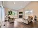 Inviting living room with a fireplace, hardwood floors, and views of the back yard at 12668 W 1St Pl # 81, Denver, CO 80228