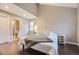 Cozy main bedroom with a vaulted ceiling, hardwood floors, and ensuite bathroom at 12668 W 1St Pl # 81, Denver, CO 80228