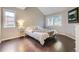 Comfortable main bedroom featuring two large windows, hardwood floors and vaulted ceiling at 12668 W 1St Pl # 81, Denver, CO 80228