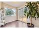 Sunroom with hardwood floors, a sliding glass door to the deck, and a large window at 12668 W 1St Pl # 81, Denver, CO 80228