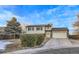 House exterior view, featuring a two-car garage and a well-maintained lawn at 12263 Clermont Ct, Thornton, CO 80241