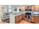 Kitchen with stainless steel appliances and wood cabinets at 12263 Clermont Ct, Thornton, CO 80241