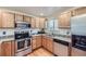 Well-equipped kitchen, featuring stainless steel appliances and granite countertops at 12263 Clermont Ct, Thornton, CO 80241