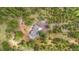 Aerial view of a home nestled in a lush forest with a private driveway at 2013 Swede Gulch Rd, Evergreen, CO 80439